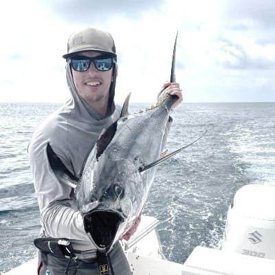 Tom Brighton, author, holding a yellowfin tuna.